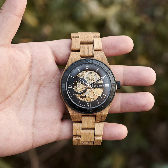 Side profile of a men's automatic skeleton wood watch, highlighting the natural wood grain.