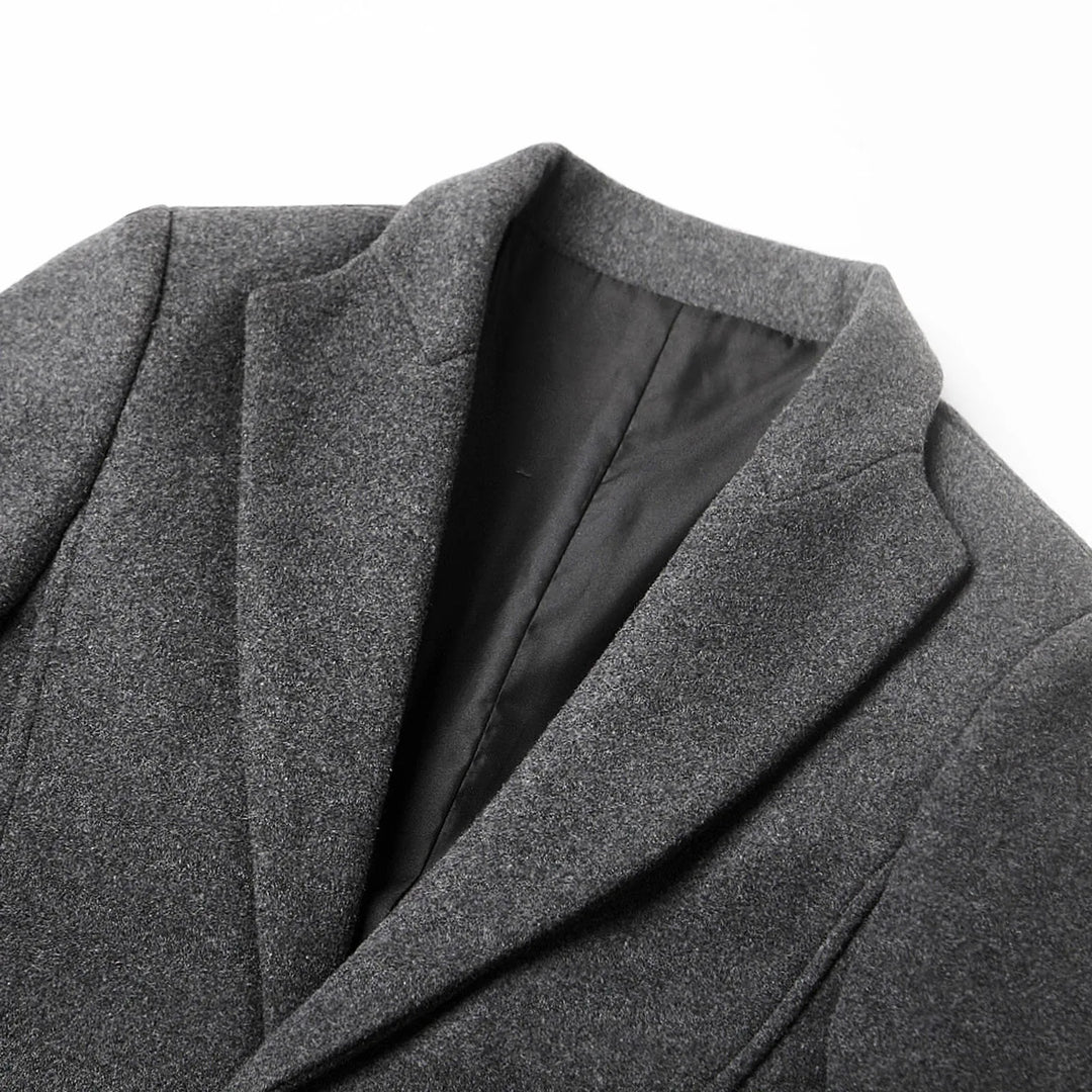 Man wearing a stylish men's tailored notch lapel trench coat, perfect for business and smart casual autumn outfits.