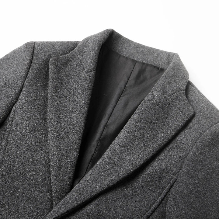 Man wearing a stylish men's tailored notch lapel trench coat, perfect for business and smart casual autumn outfits.