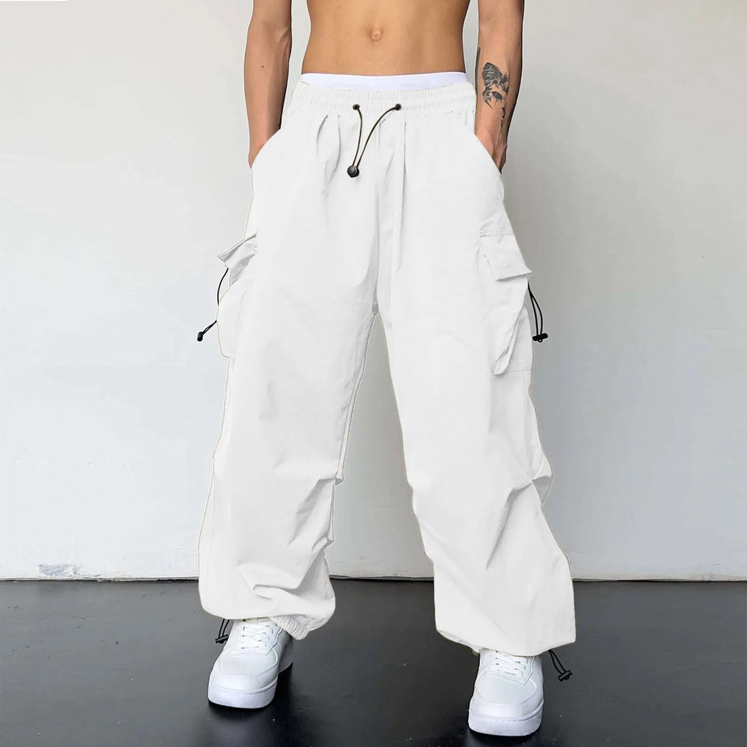 Men's baggy cargo parachute pants, loose fit, streetwear style with drawstring waist. Perfect for urban fashion.