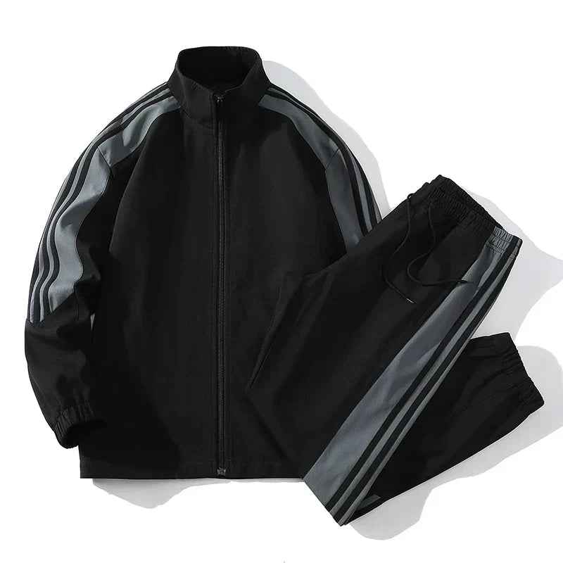 Men's black athletic jogger set with zipper jacket, ideal for sportswear and casual wear