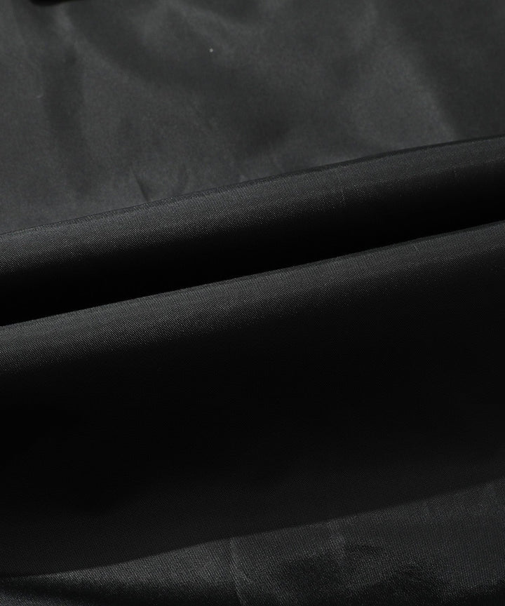 Full-length view of men's bomber jacket, brown PU leather, with zipped pockets, detachable hood.