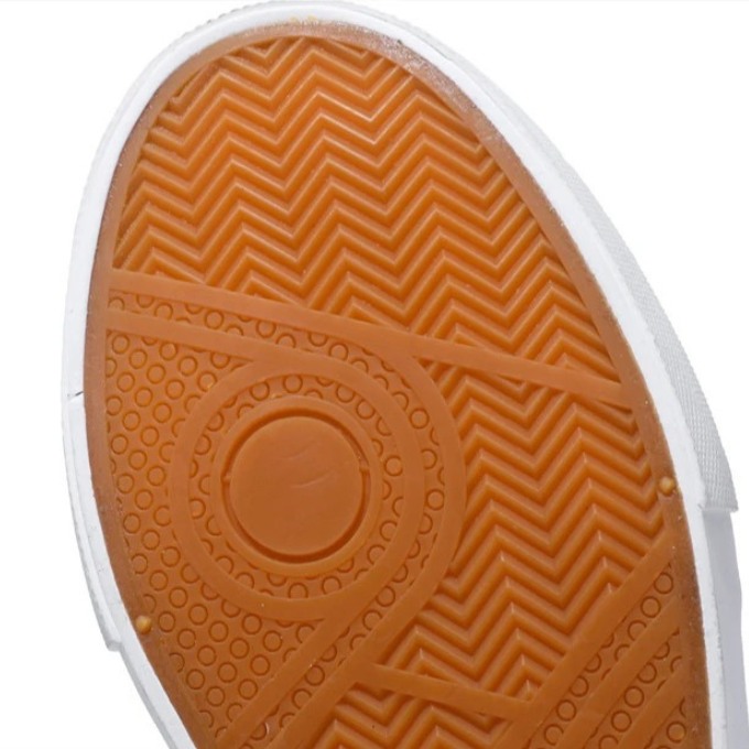 Men's white casual sneakers with suede accents, an everyday shoe blending style and comfort
