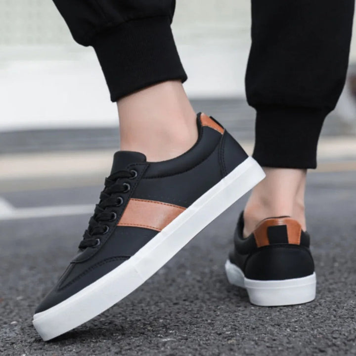 Stylish men's white casual sneakers with subtle suede accents, great for everyday wear