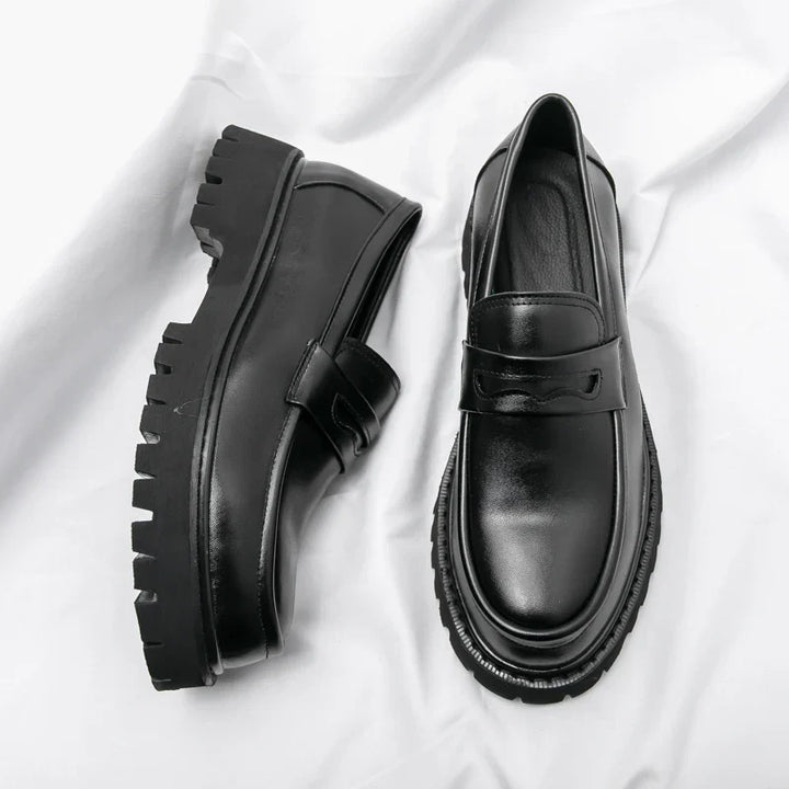 Men's black chunky sole loafers. Modern slip-on dress shoes for stylish men, comfortable & versatile fashion footwear.