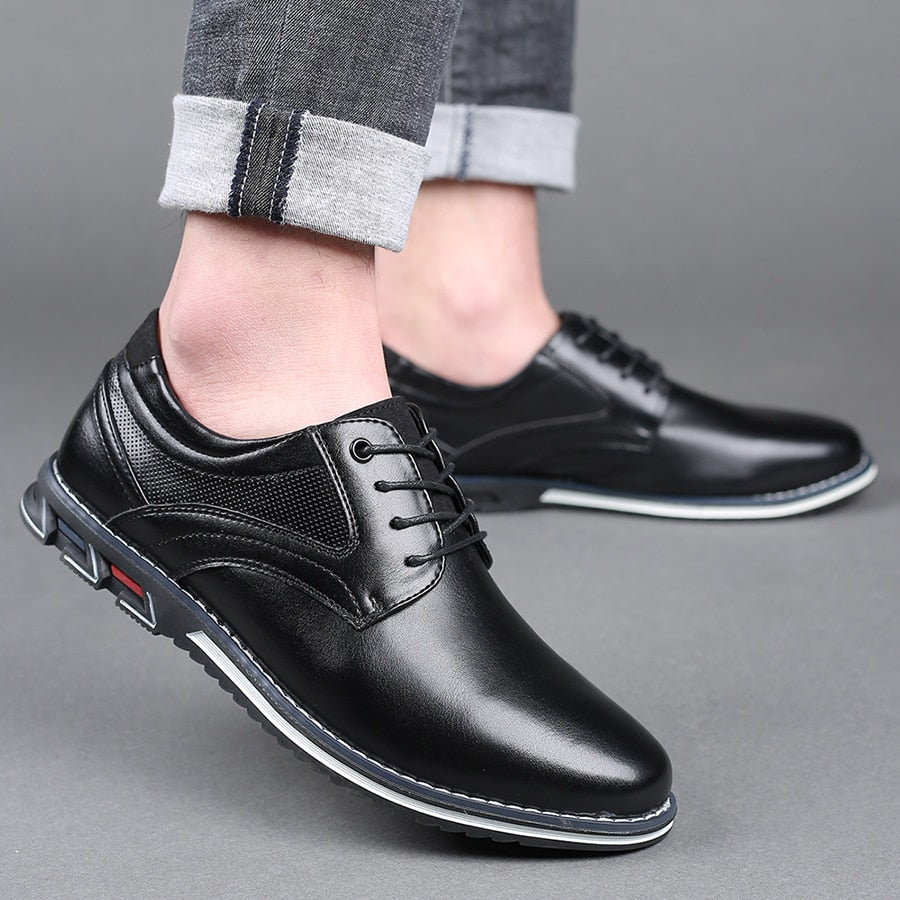 Men's genuine leather dress shoes, black, showcasing their durable and elegant design.