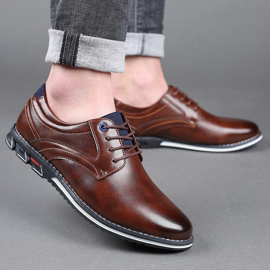 A pair of men's polished brown leather shoes, ready for a formal or business setting.