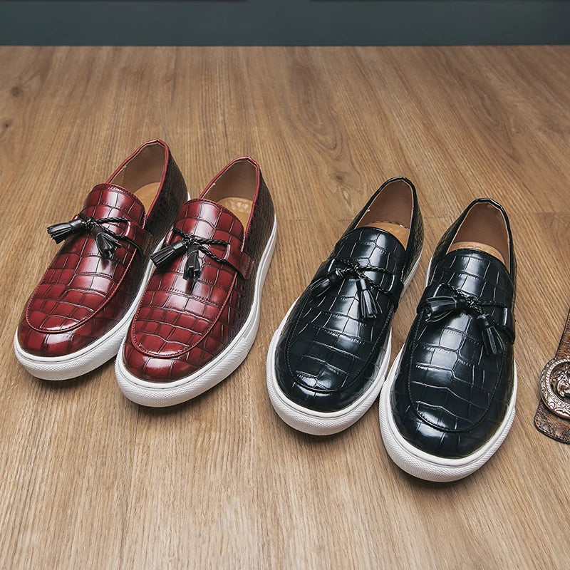 Detail of the croc print and tassel on men's embossed leather loafers, high-quality footwear