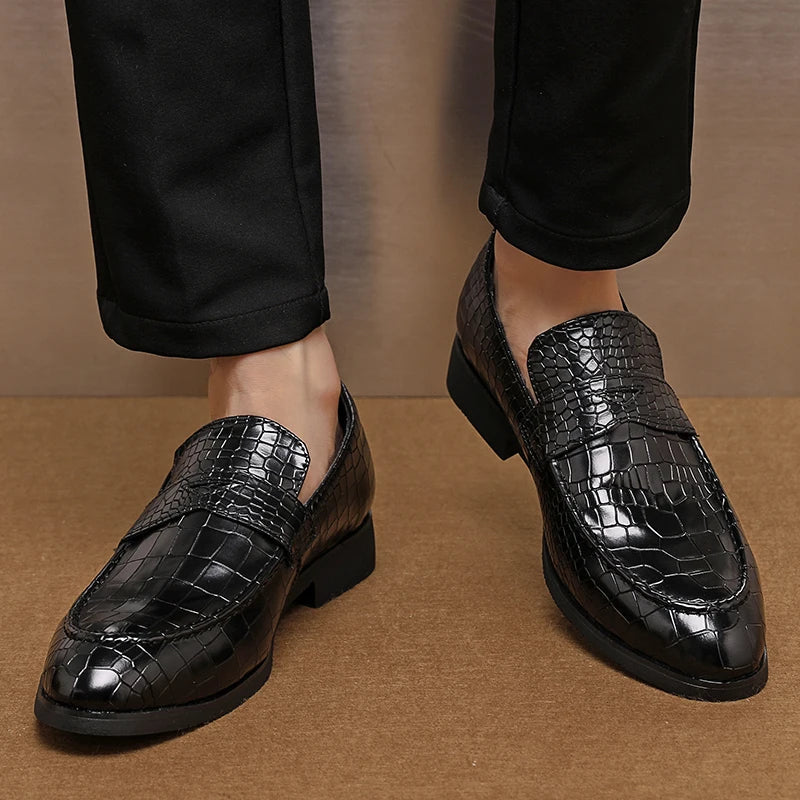 Detail of the crocodile embossed pattern on men's premium leather loafers