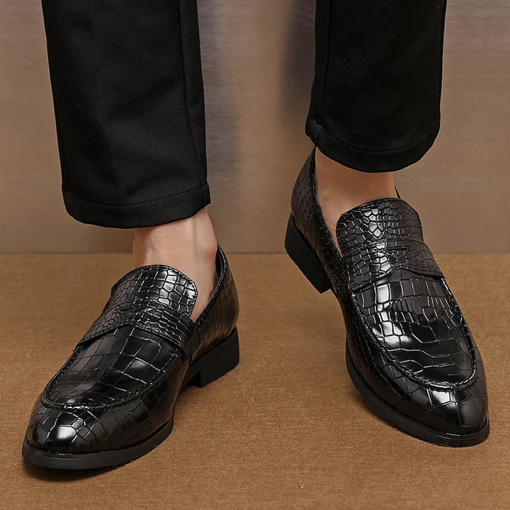 Detail of the crocodile embossed pattern on men's premium leather loafers