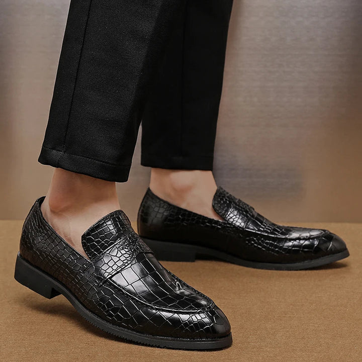Top view of men's slip-on crocodile embossed leather loafers, showcasing the design