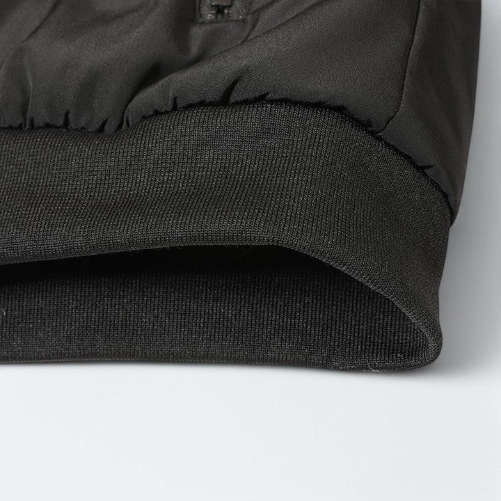 Close-up of the waterproof fabric on a men's everyday comfort jacket, highlighting its durable and protective features.