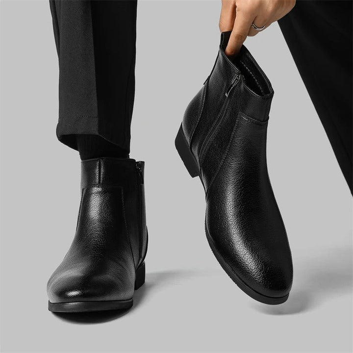 Sophisticated men's footwear: black leather ankle boots with a stylish side zipper closure
