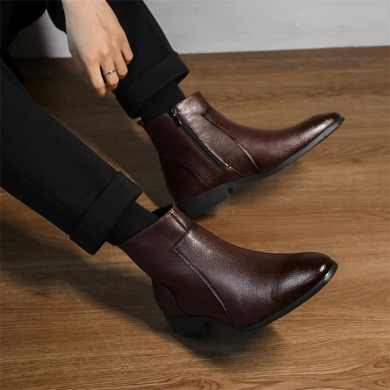 Detailed shot of the side zipper on men's genuine leather ankle boots, highlighting product quality