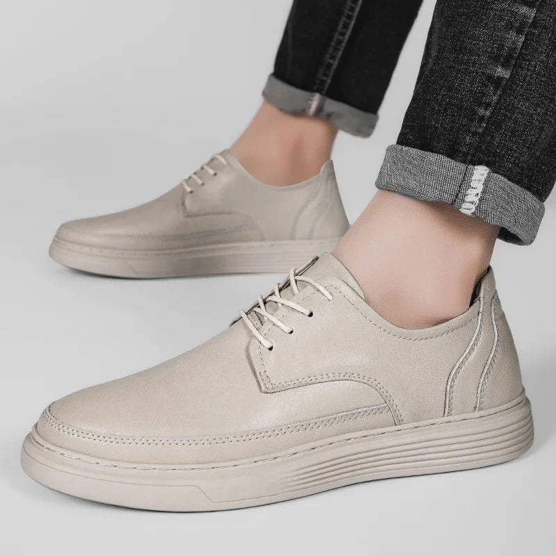 Action shot of men's leather dress sneaker, showing flexibility and ease of movement.