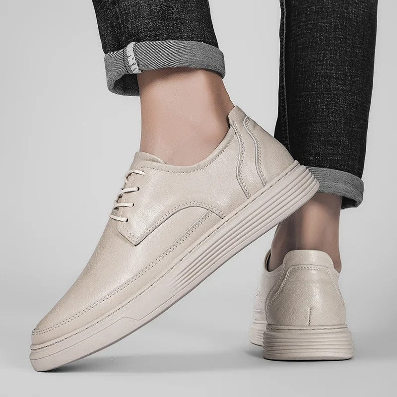 Close-up of the stitching and craftsmanship on a men's premium leather dress sneaker hybrid.