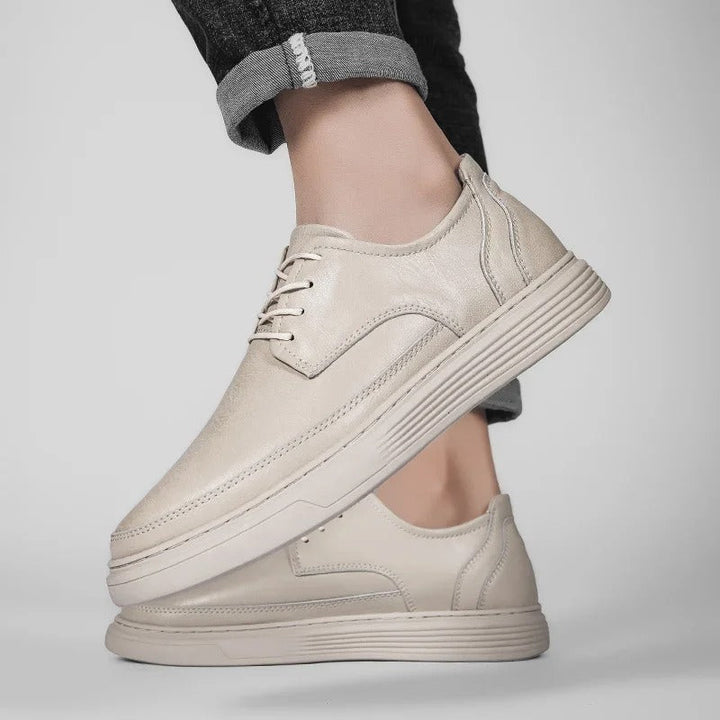 Men's tan leather dress sneaker hybrid, a stylish and comfortable option for everyday wear.