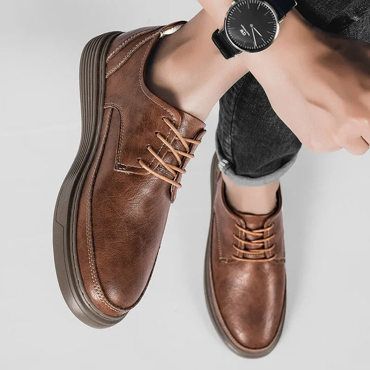 Side profile of a men's versatile leather dress sneaker hybrid, ideal for both office and weekend.
