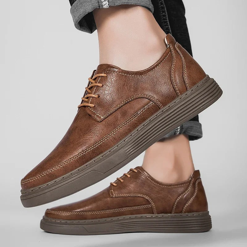 Top-down view of men's leather comfort footwear, a hybrid dress sneaker for modern men's fashion.