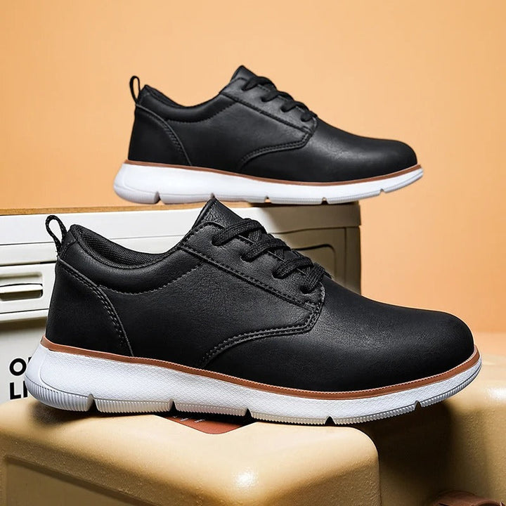 Stylish men's brown leather sneakers, perfect for casual outfits, featuring durable construction and comfortable fit.