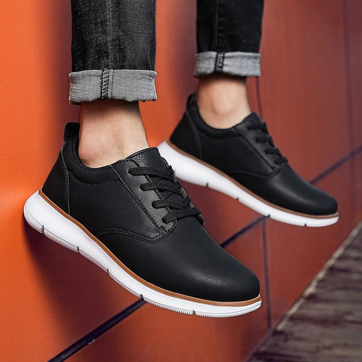 Close-up of the textured leather on men's casual sneakers, highlighting the quality and craftsmanship.