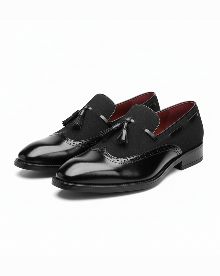 Men's black leather tassel loafers with classic brogue detail and comfortable sole for formal wear