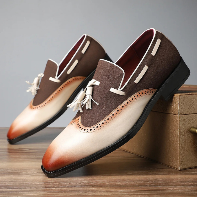 Formal men's footwear: sophisticated tan leather tassel loafers with decorative brogue pattern