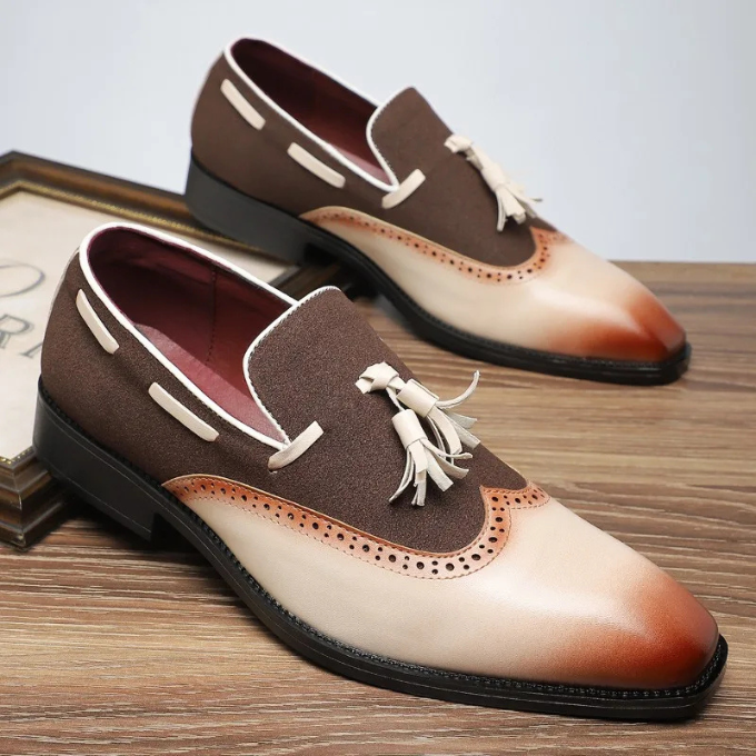 Side view of mens' slip-on tassel loafers showcasing traditional brogue detail and comfort sole