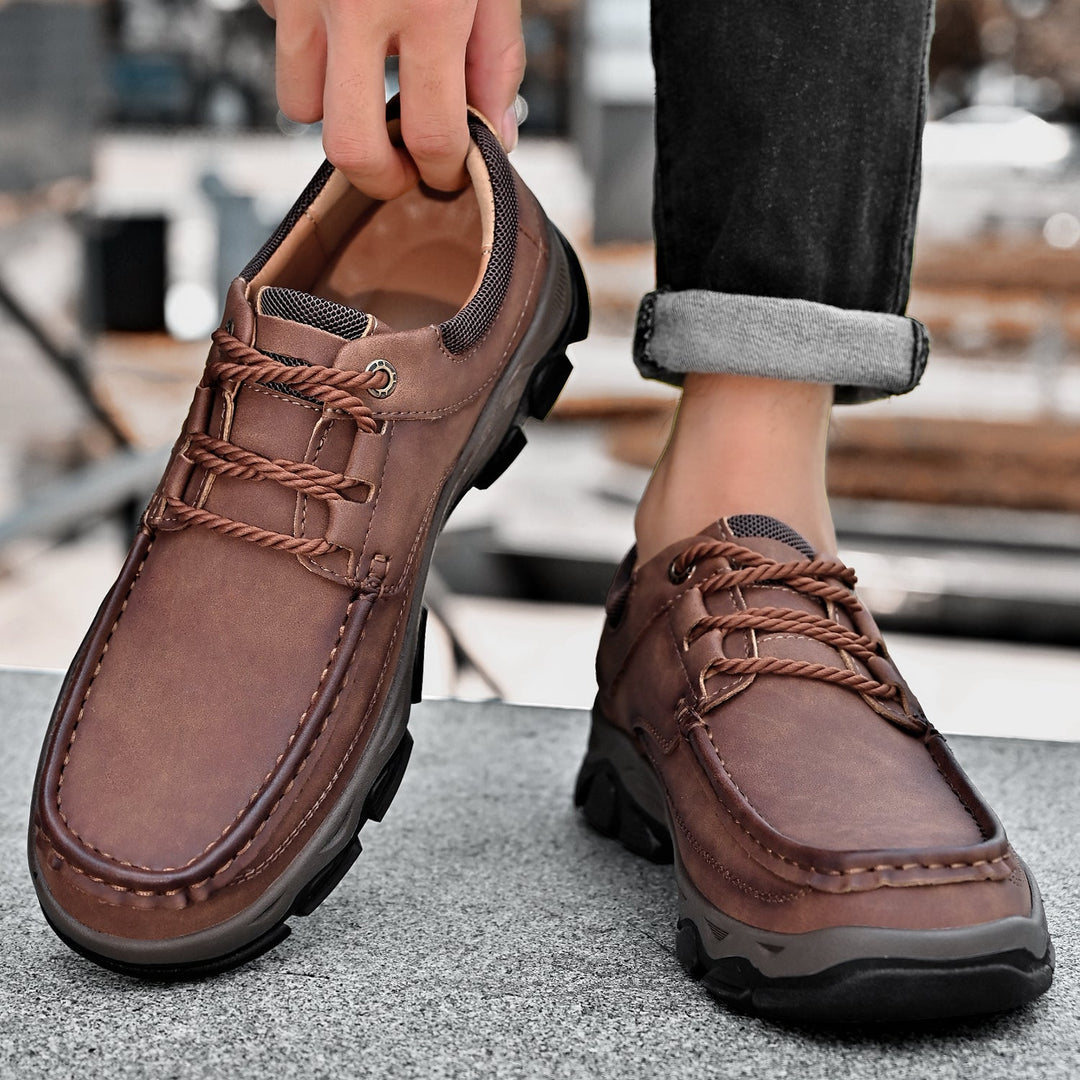 Collection of men's orthopedic casual loafers in various colors: black, brown, grey, tan