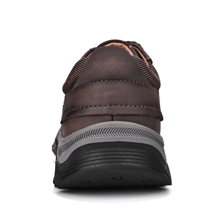 Men's orthopedic laced loafers on a wooden floor, accentuating their casual yet refined look
