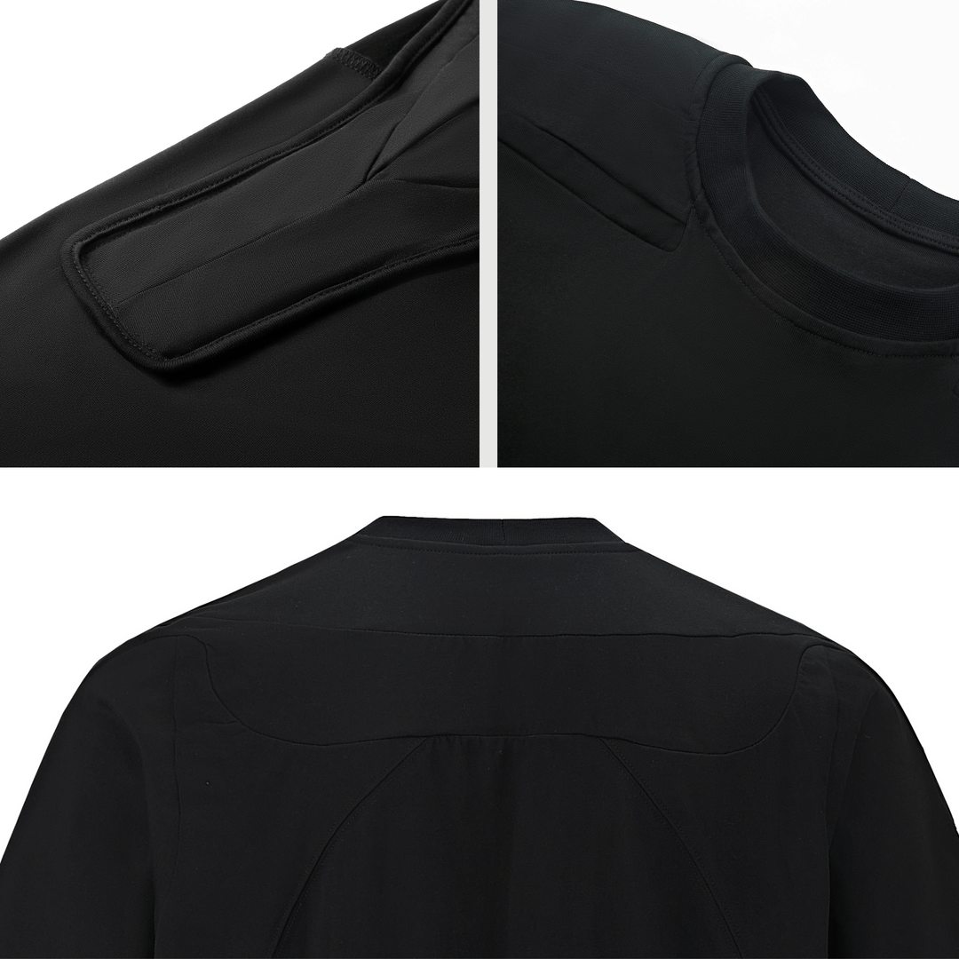 Close-up of the padded shoulder detail on a men's black muscle tee, casual-athletic style.