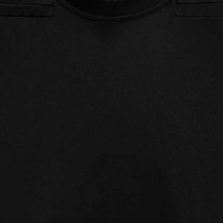 Man wearing a navy blue padded shoulder muscle tee, showcasing an athletic fit.