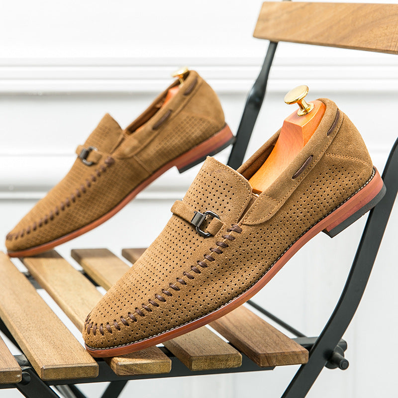 Men's black loafers with intricate perforated pattern and an elegant buckle closure