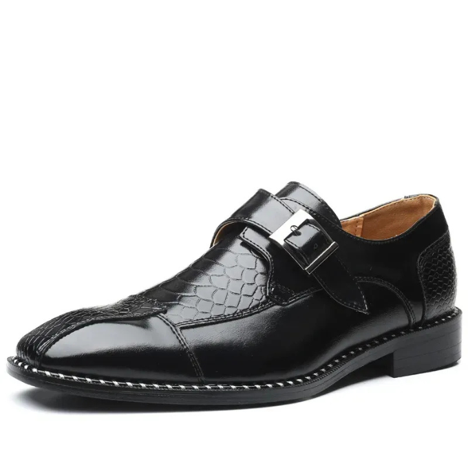 Close-up on the intricate reptile pattern of men's stylish monk strap formal footwear.
