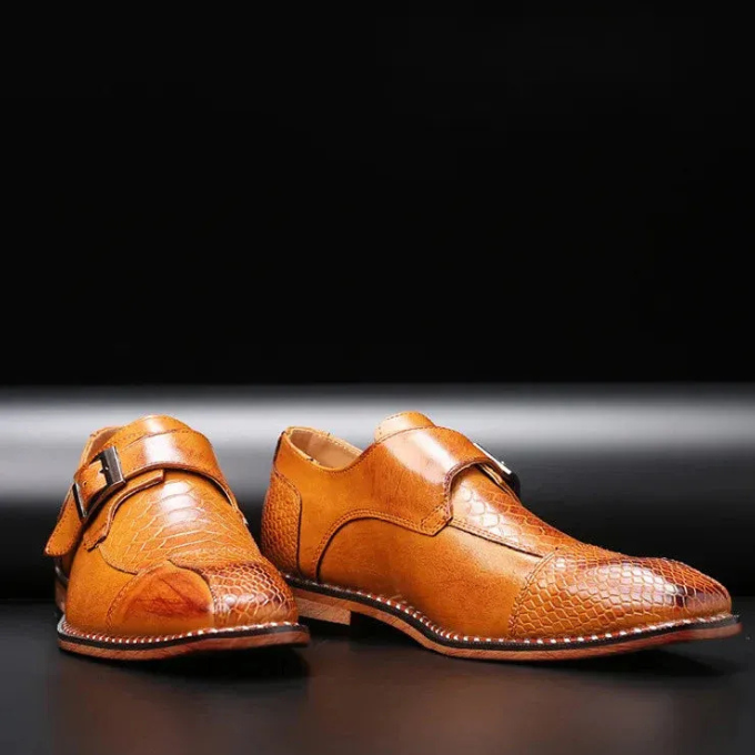 Front view of men's gothic-inspired reptile-textured monk strap formal shoes for parties.