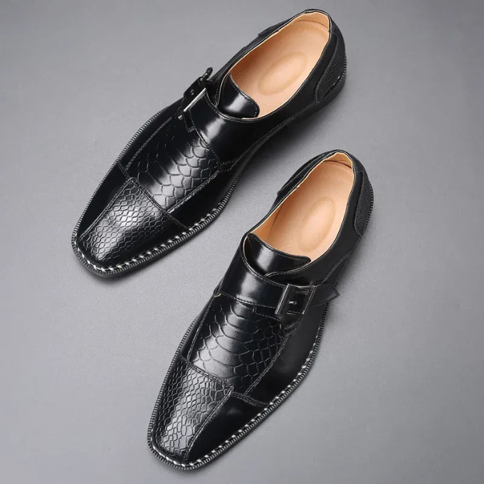 Angled shot of men's formal reptile-textured monk strap dress shoes, perfect for events.