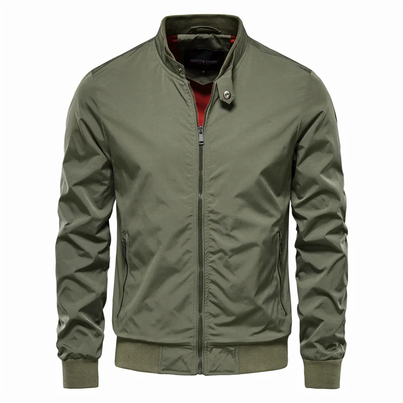 Close-up of a men's gray streetwear zip jacket, showing textured fabric and zipper detail. Urban outerwear.