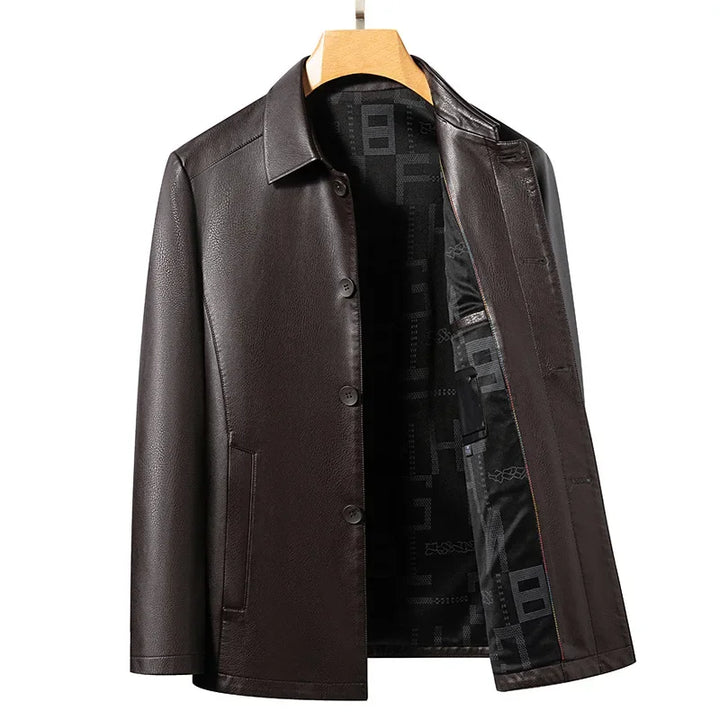 Close-up of pebble-grain vegan leather on a men's moto jacket, black, high quality texture