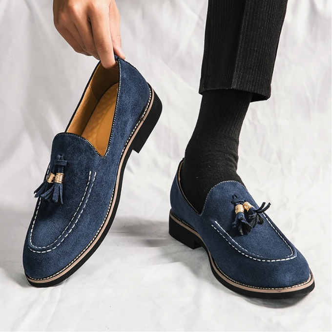Men's fashion loafers: deep green velvet with statement tassels, sophisticated footwear