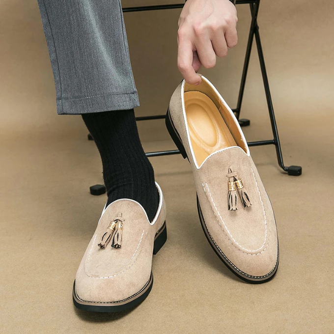 Pair of luxurious men's velvet tassel loafers, ideal for fashion-forward outfits