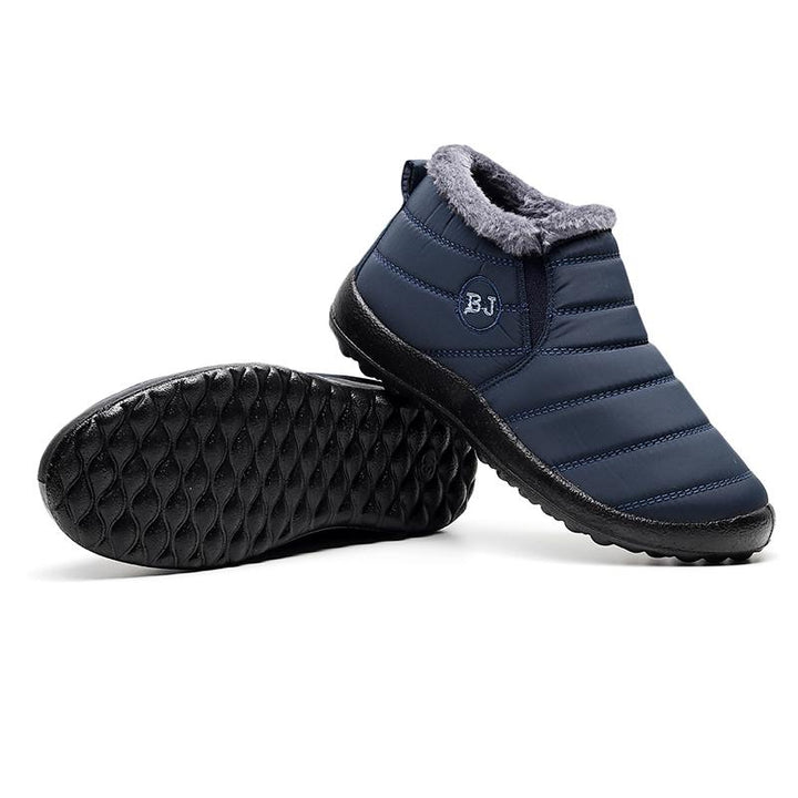 Side view of a men's casual outdoor boot, grey, waterproof, featuring a warm interior and durable rubber sole.