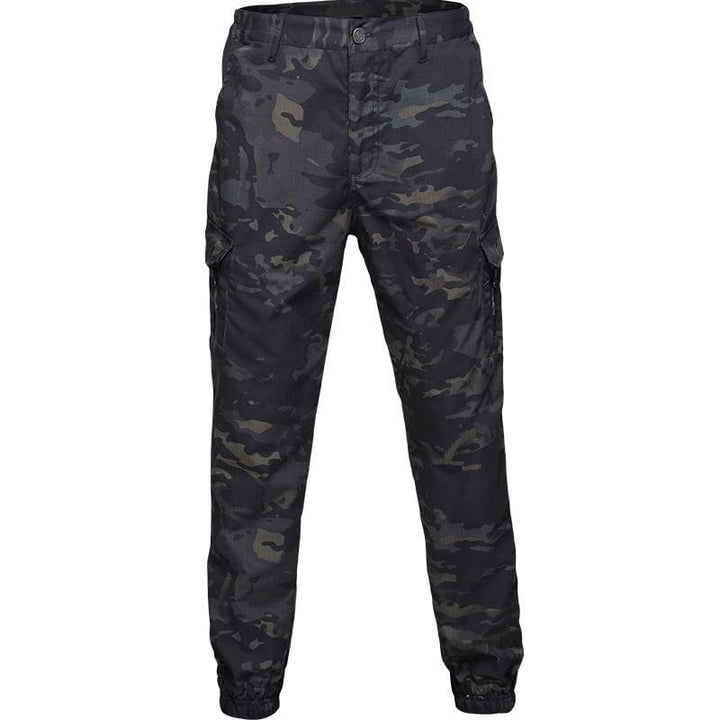 Full-body view of men's waterproof jogger pants in an urban setting, highlighting casual techwear style