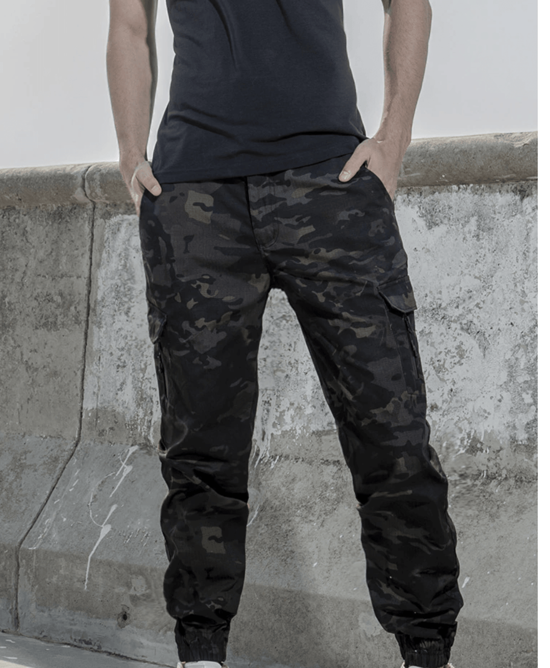 Men's casual waterproof jogger pants paired with a t-shirt, showcasing a relaxed outdoor look
