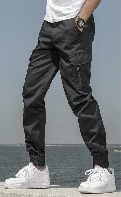 Detail of the adjustable ankle cuffs on men's waterproof tech jogger pants
