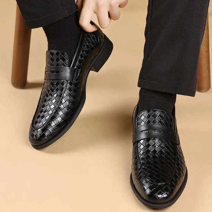 Back view of men's black woven leather slip-on loafers, showing heel support.