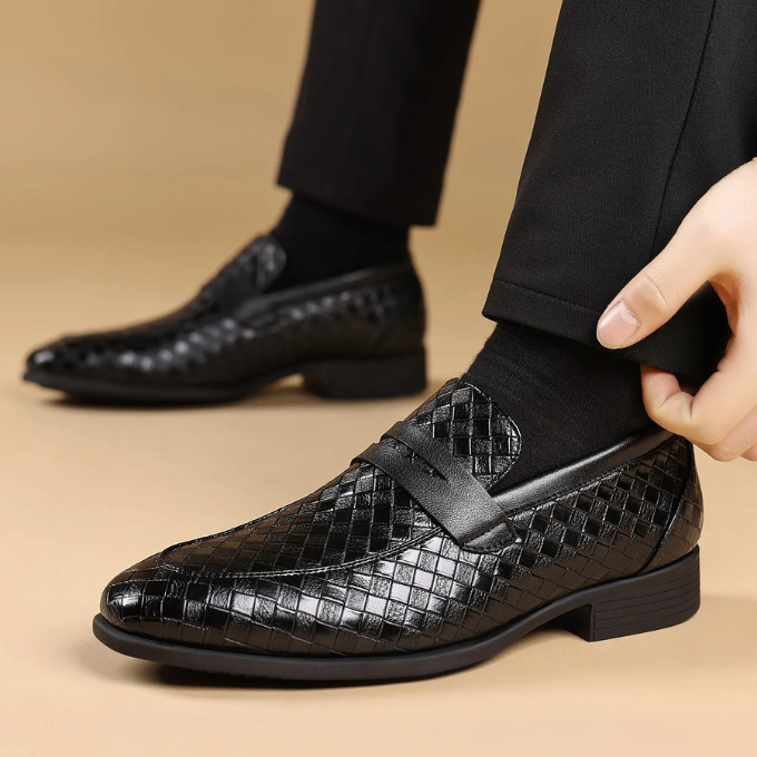 Group of men's woven leather loafers in black and brown, emphasizing variety and quality.