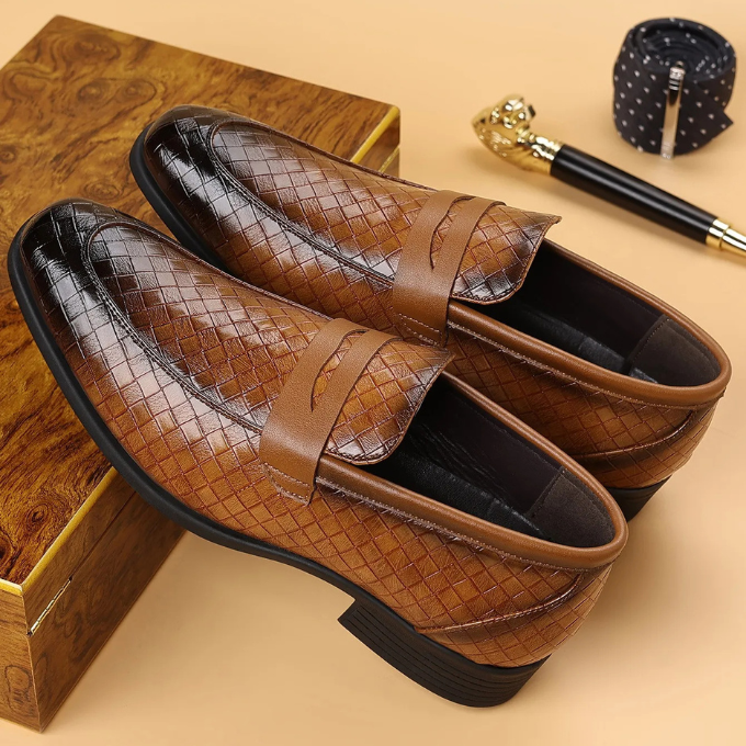 Pair of classic brown woven leather slip-on loafers for men's fashion and everyday comfort.