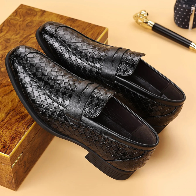 Detail of the comfortable inner lining of men's woven leather slip-on loafers.