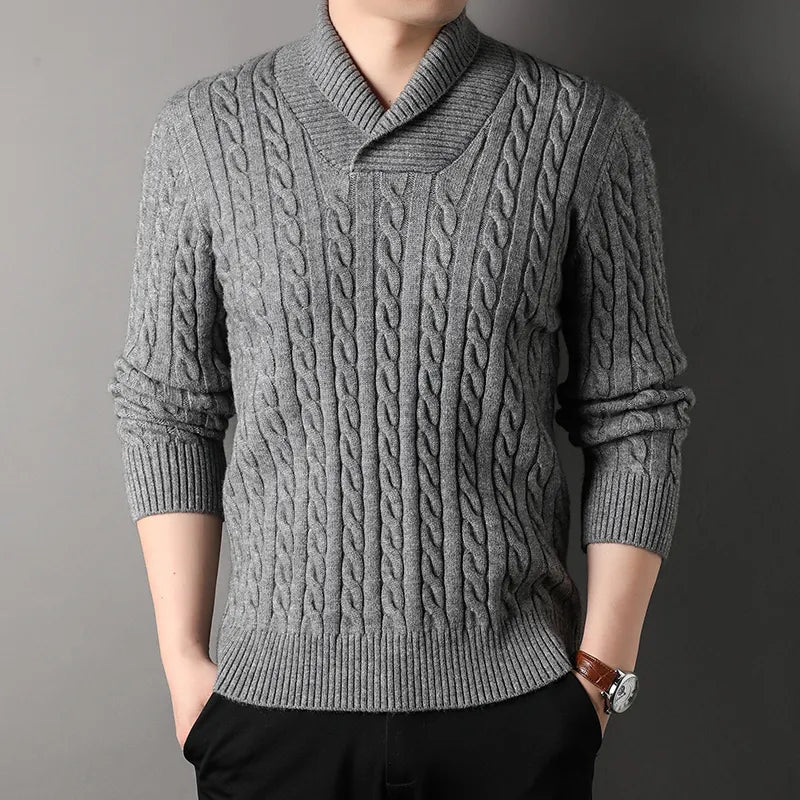 Men's casual cable knit pullover sweater made from a soft cashmere blend, providing warmth and comfort.