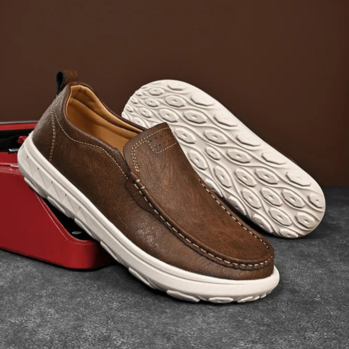 Stylish men's suede slip-on loafers in navy blue, comfortable casual shoe.